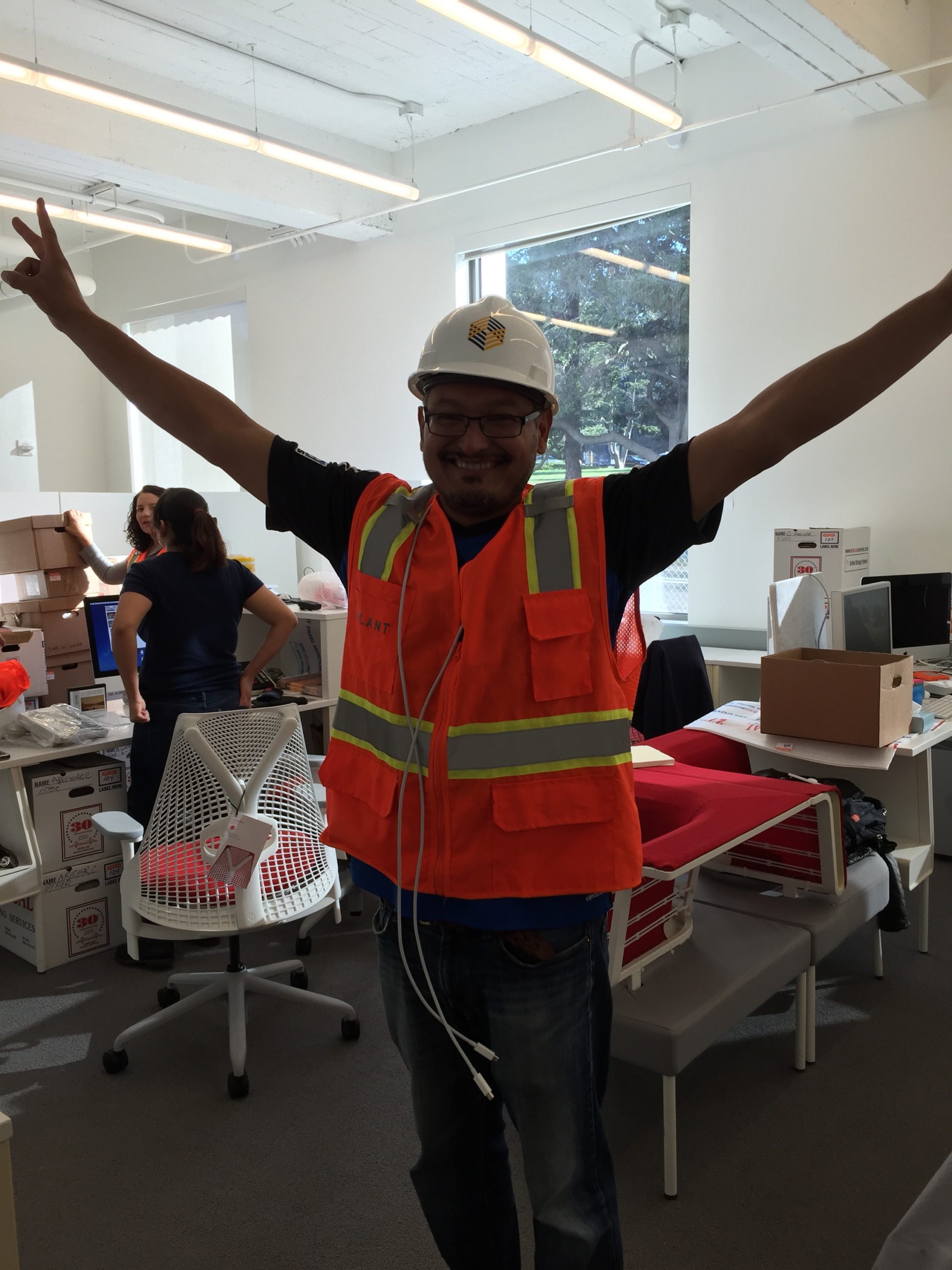 Orlando wearing a hard hat at BAMPFA