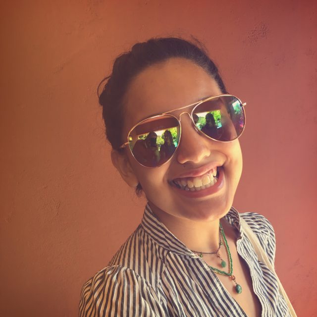 Valentina wearing sunglasses and smiling