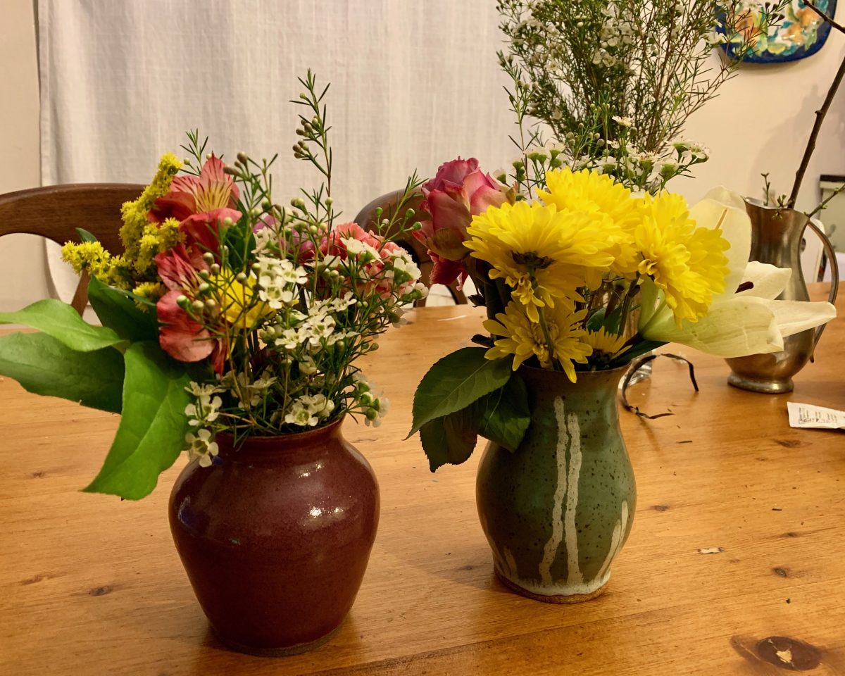 Two flower arrangements with flower pots made by Camila