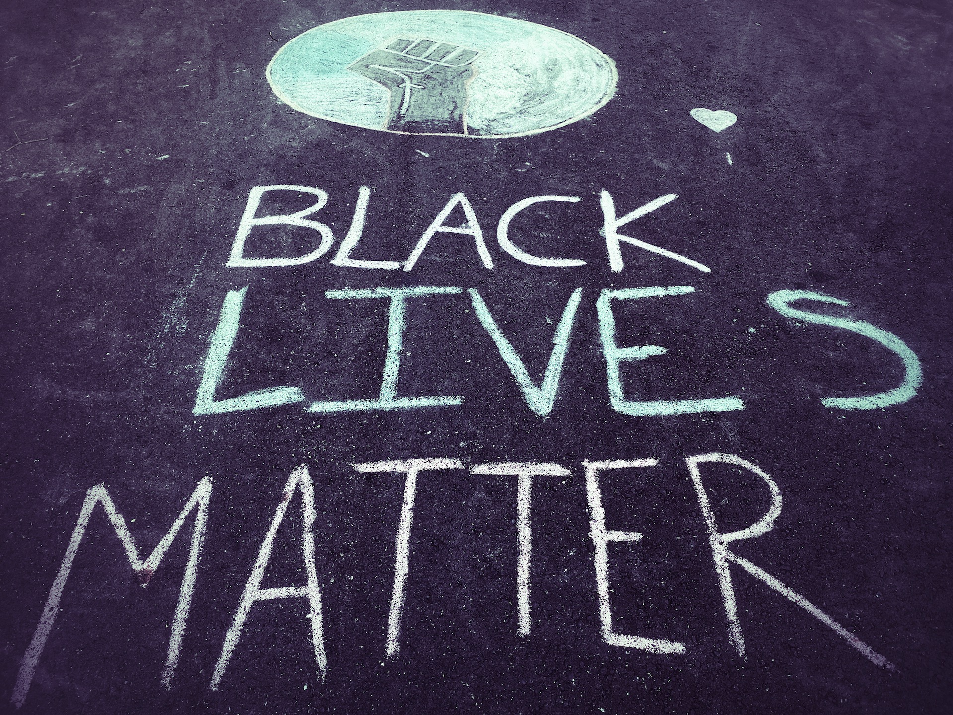 Black Lives Matter written on a sidewalk with chalk