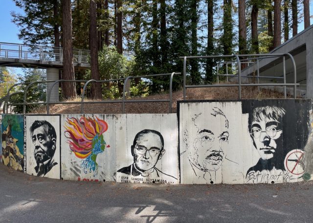 A mural in the Merrill Moat of César Chavez, Monseñor Romero, MLK jr. and John Lennon.