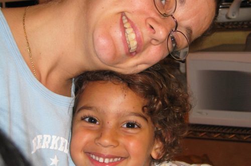 A mother and her child smiling
